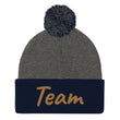 Team In Celluloid Embroidery On Pom Pom Beanie